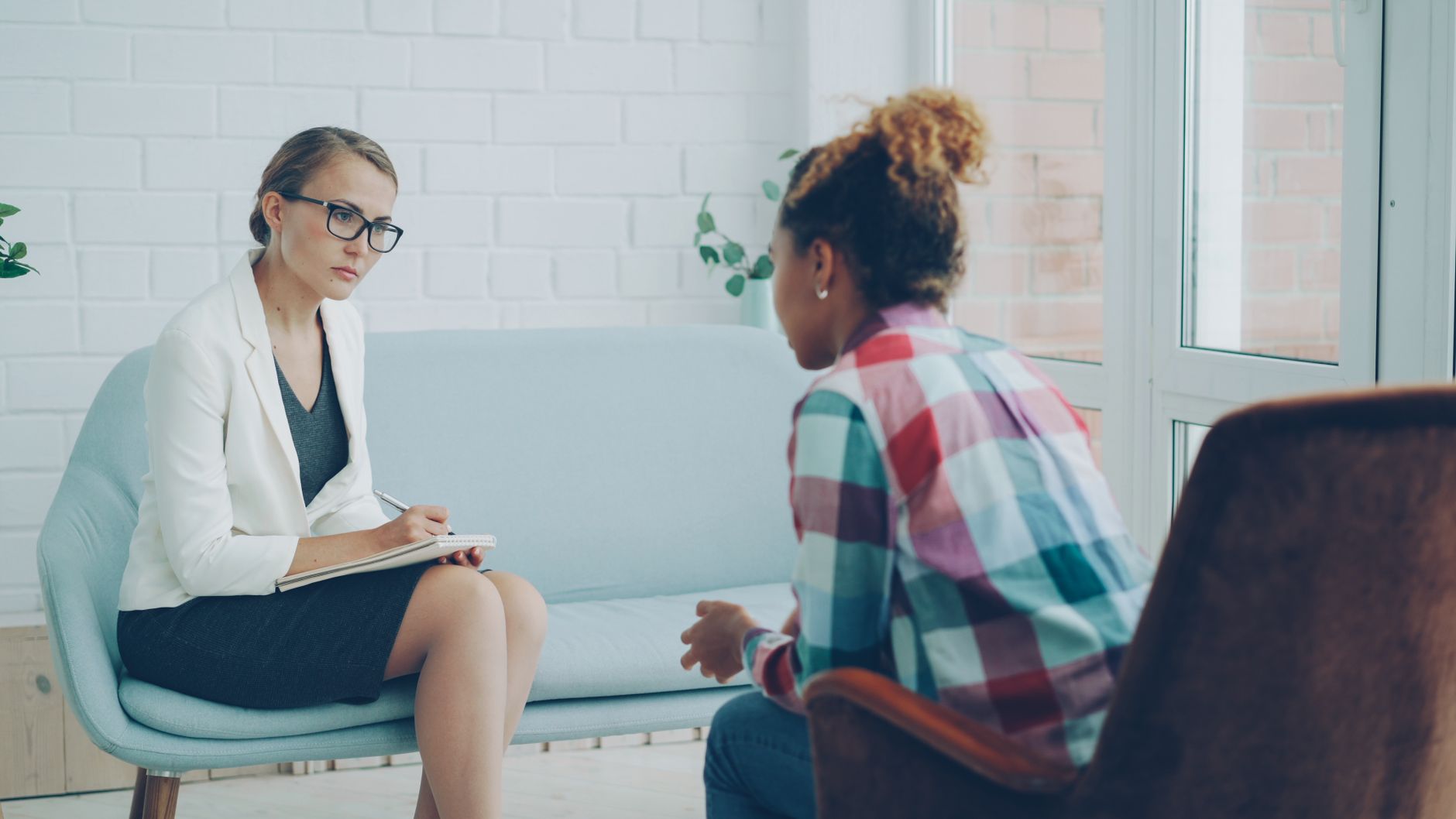 Therapist and client in a session, illustrating whether insurance covers mental health treatment after an accident