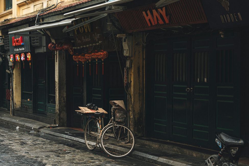 Bicycle on a city street beside moving traffic