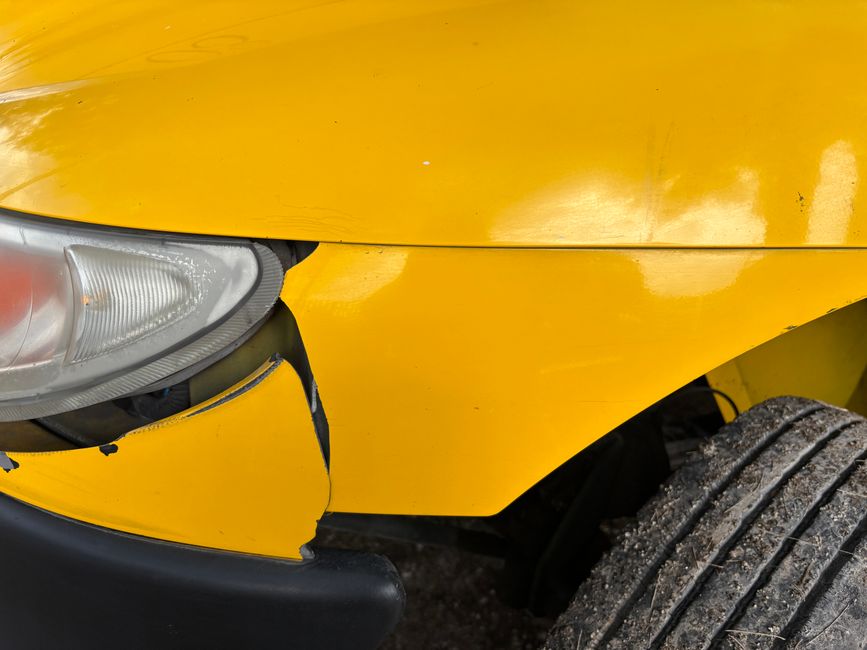 Damaged front bumper of a car after a collision