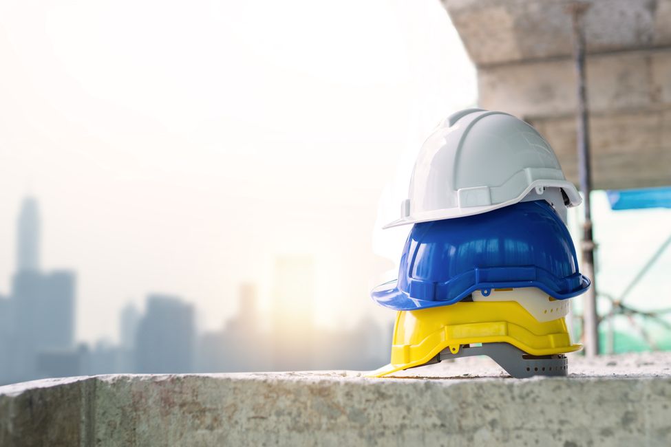 Construction worker wearing a safety helmet on site