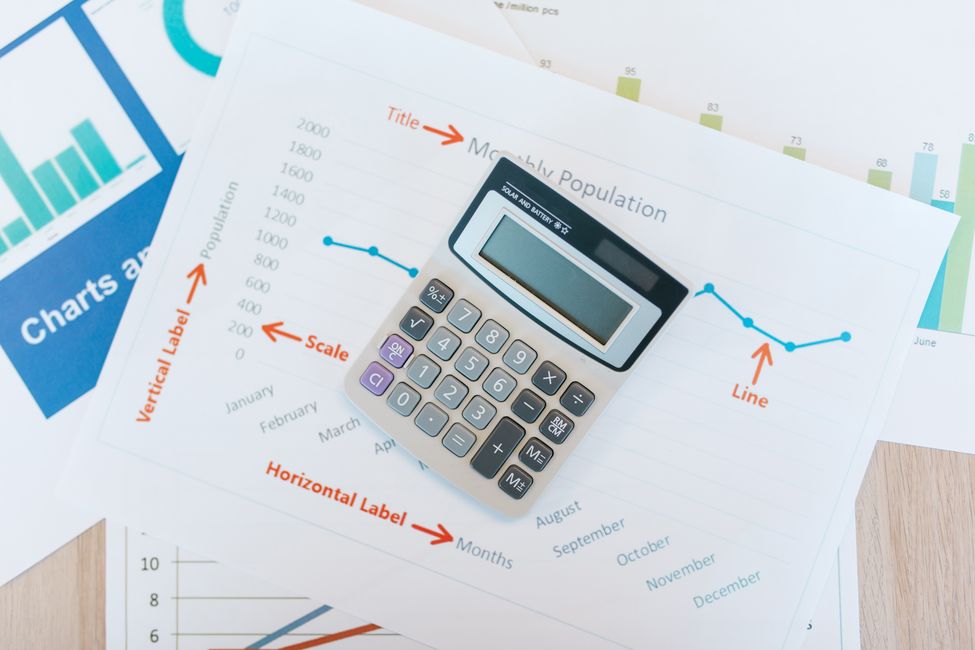 Calculator resting on financial documents